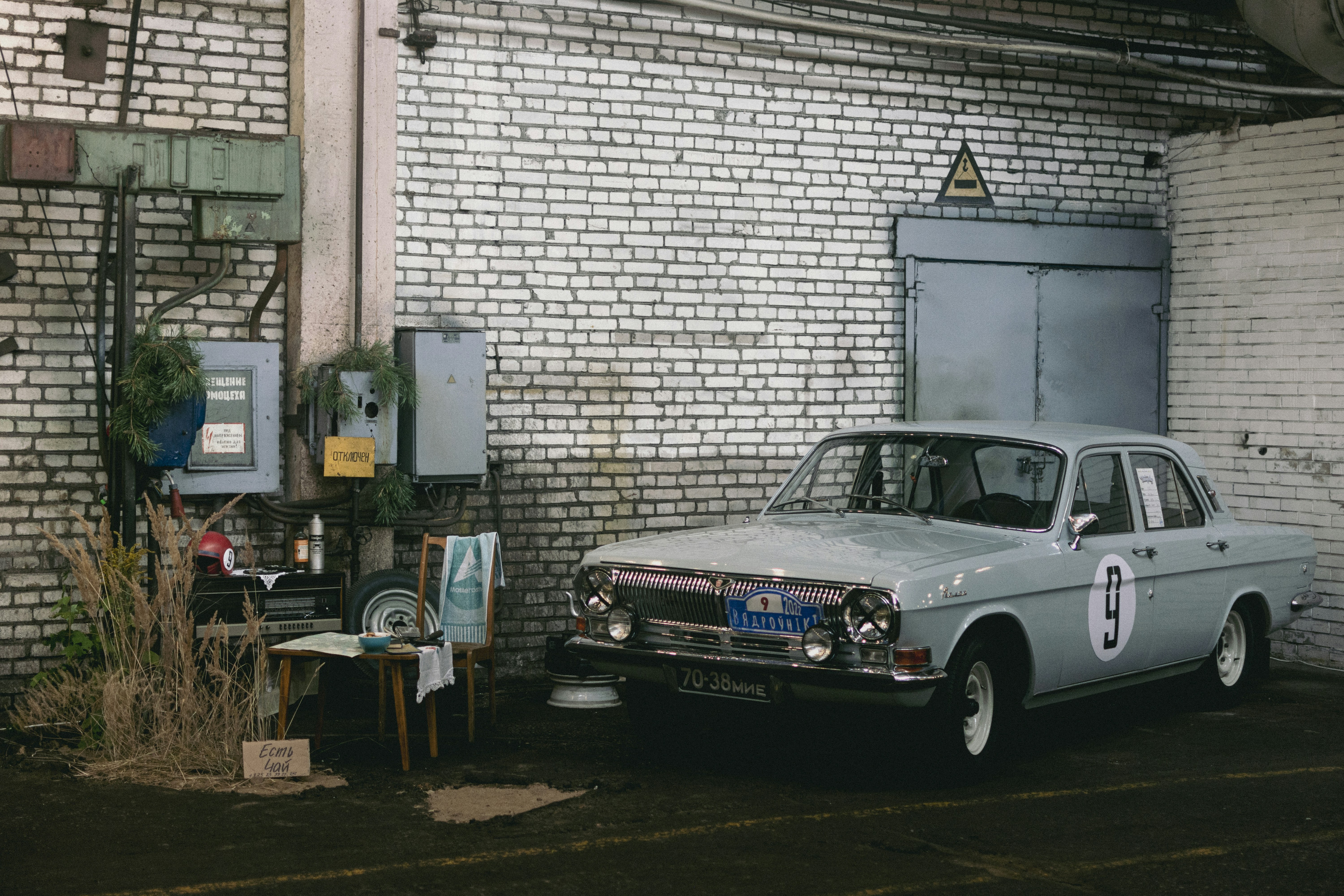 A car parked in front of a brick building photo – Free Vintage Image on ...
