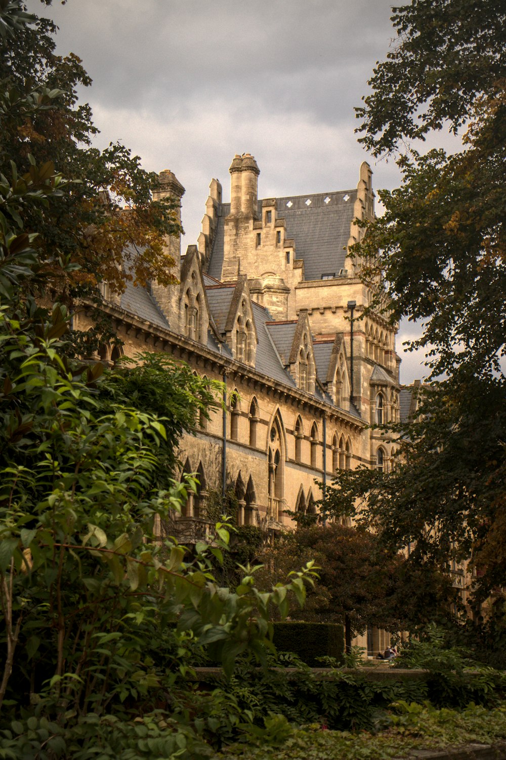 a large building with trees in front of it