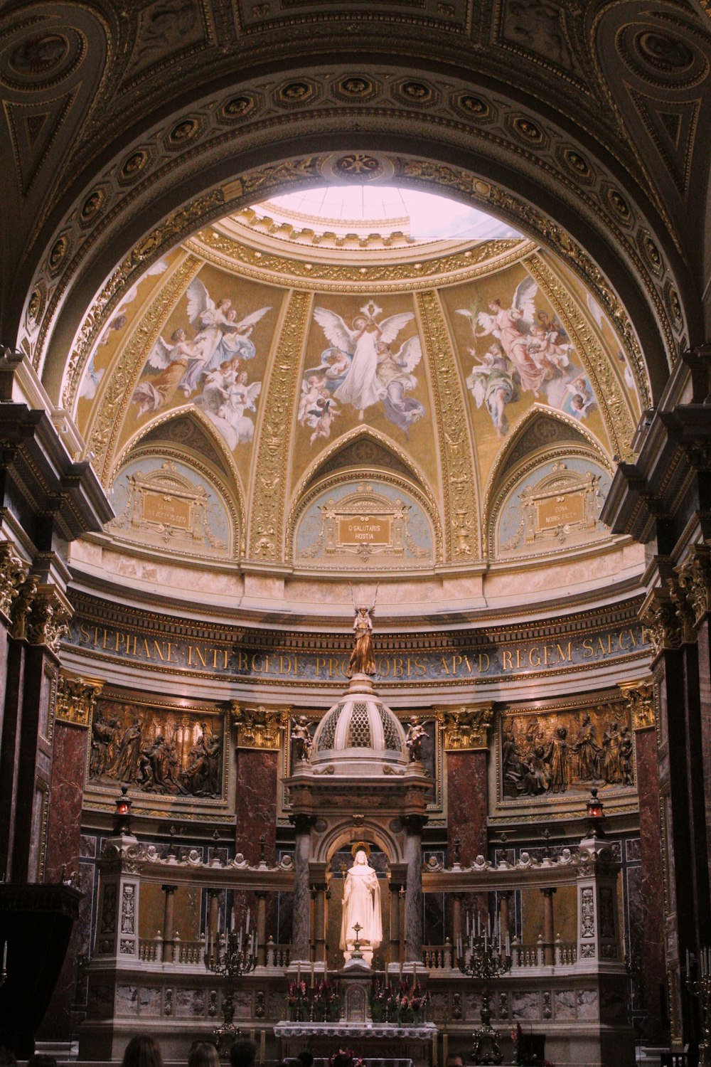 a large ornate ceiling with statues