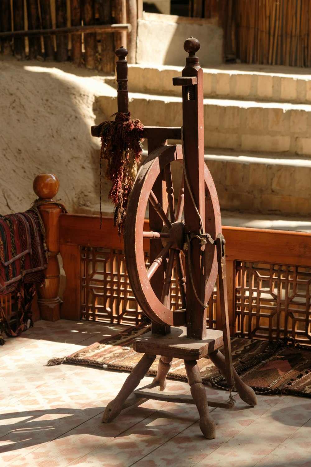 a wooden carriage with a wooden wheel