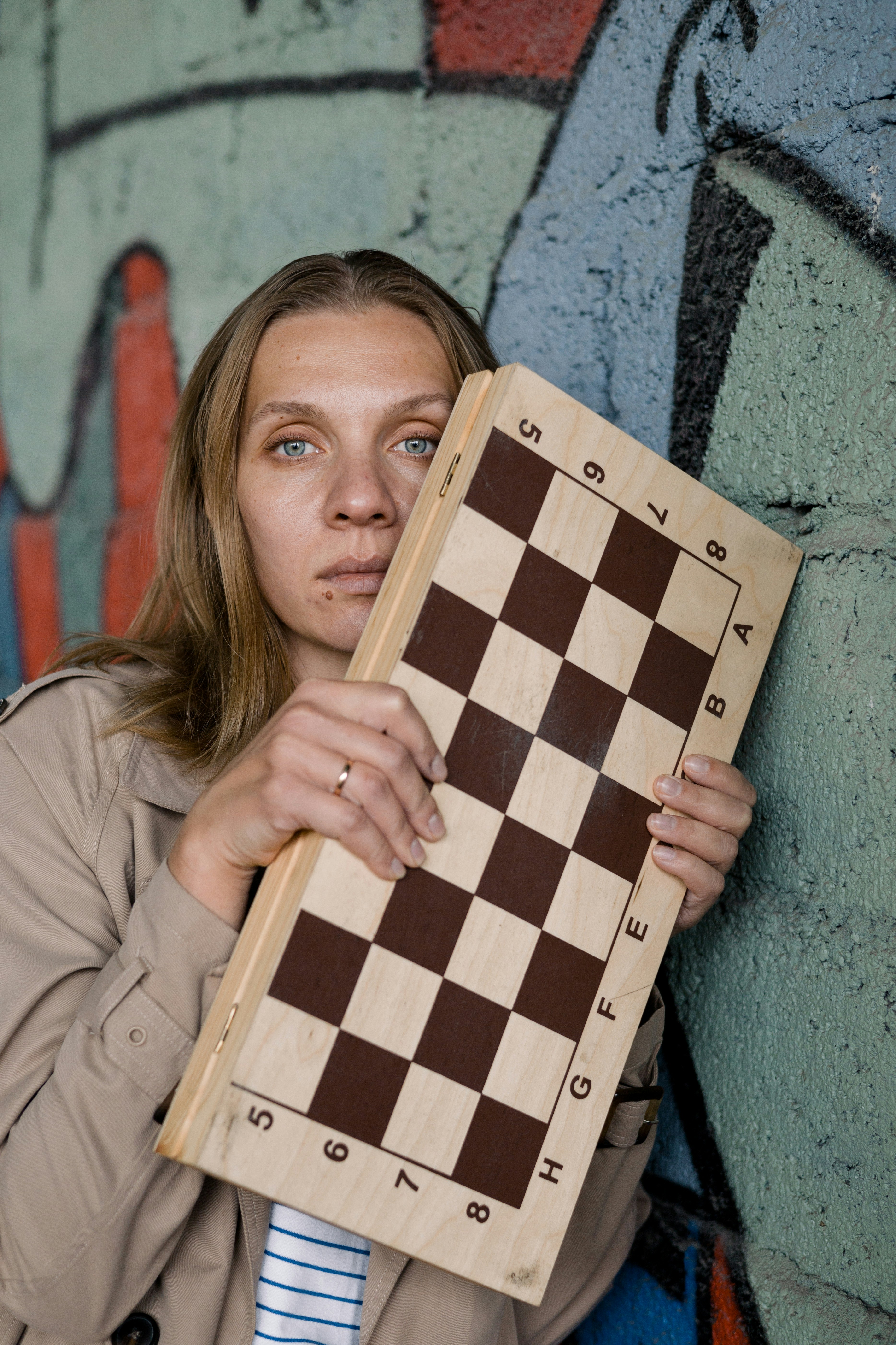 a woman holding a large wooden box