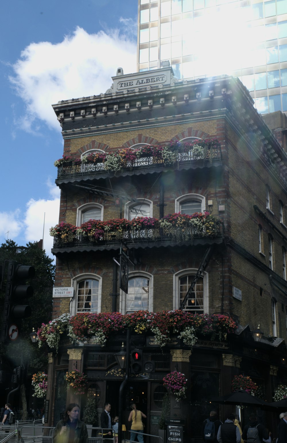 a building with flowers on the roof