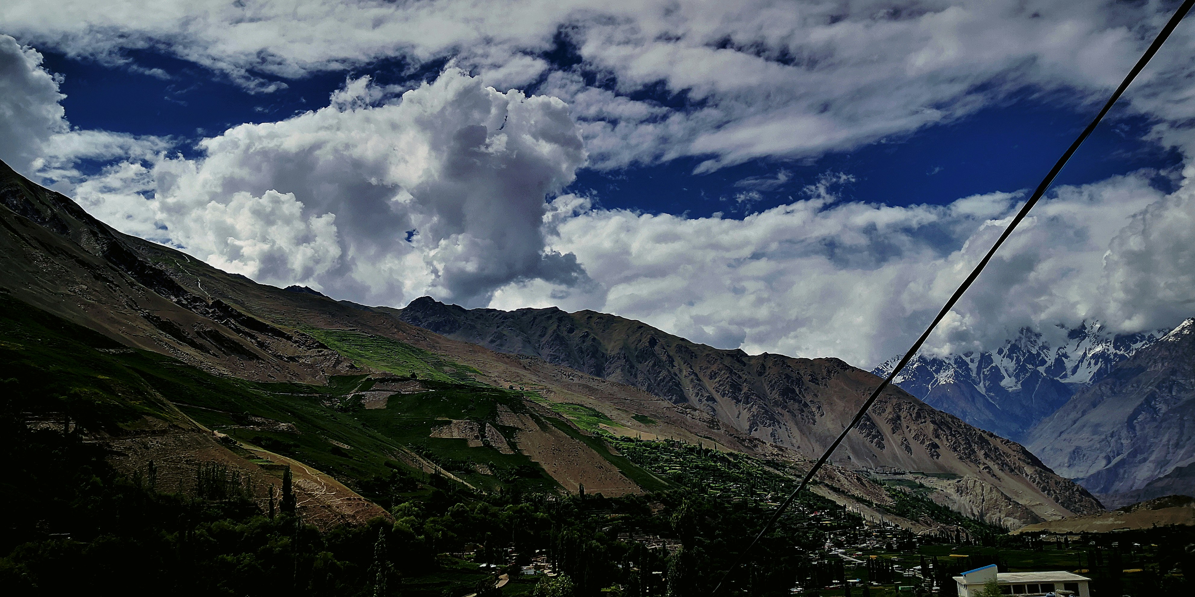 a view of a mountain range from a cable car