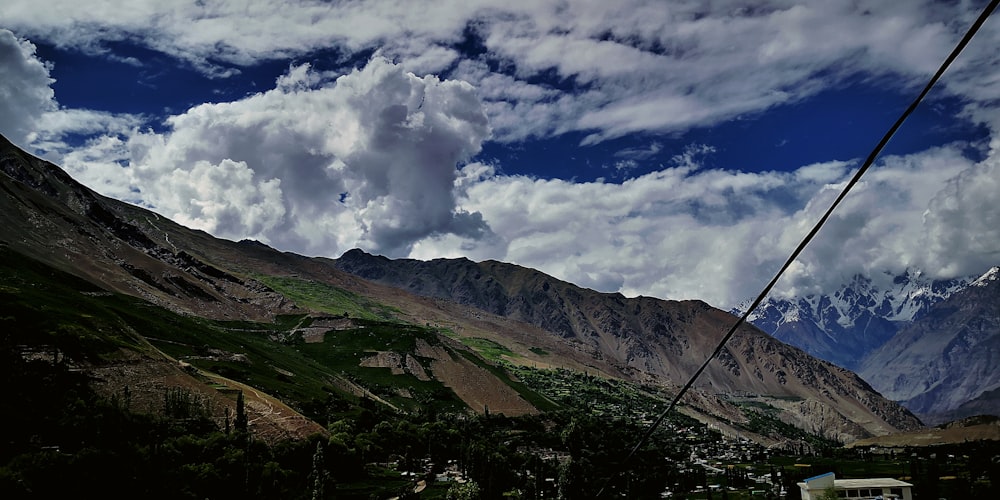 a view of a mountain range from a cable car