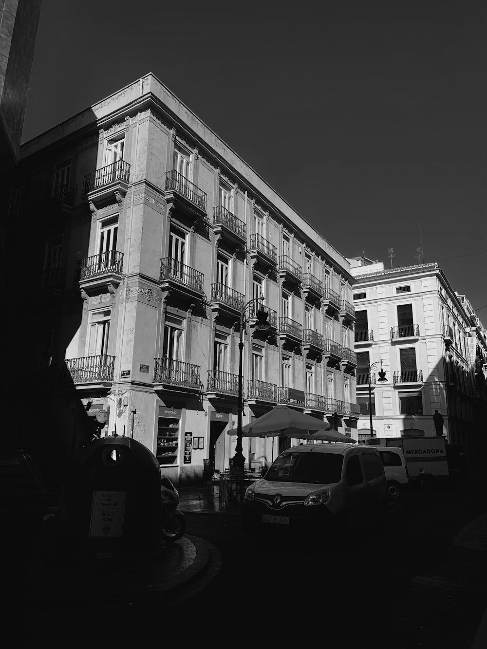 a street with cars parked on the side of it