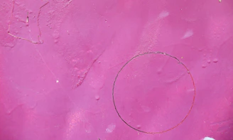 a pink surface with a drawing on it