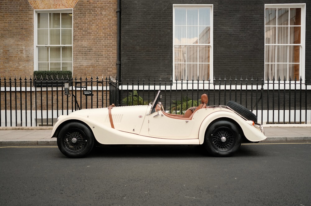 a person driving a convertible car