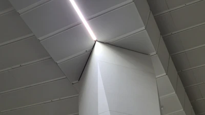 Finished retail space showcasing clean drywall and architectural finishes with strong geometric lines.