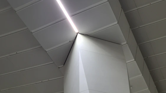 Modern minimalist architectural office space with cozy lighting and clean lines.