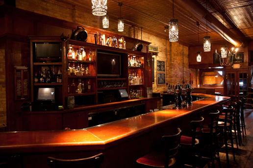 a bar with a bar and chairs