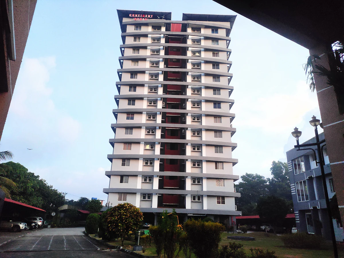 A tall residential tower against the sky