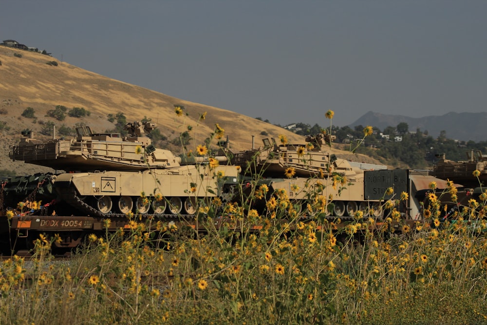 a group of military tanks in a field