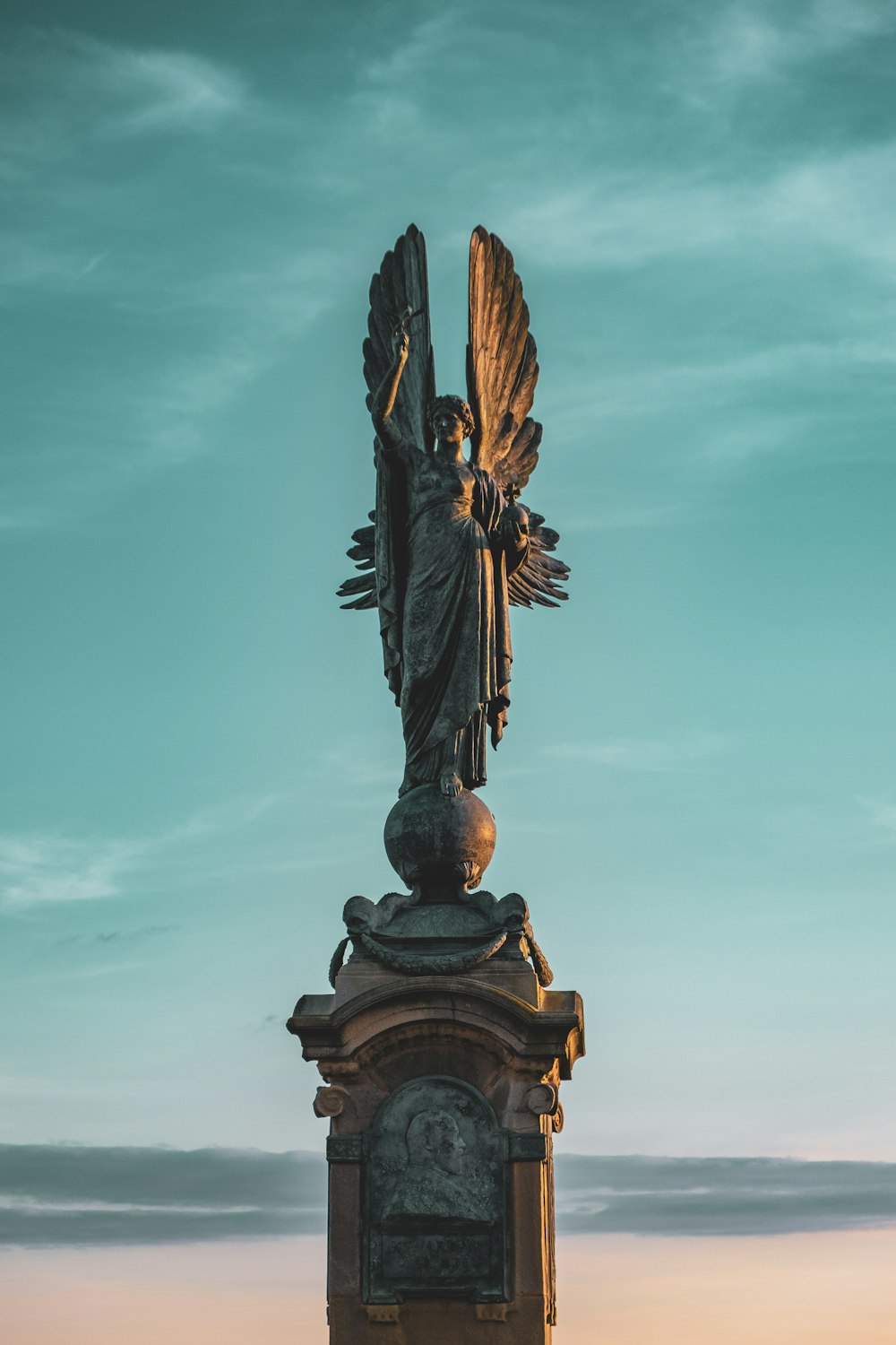 a statue of a person with a sword and shield