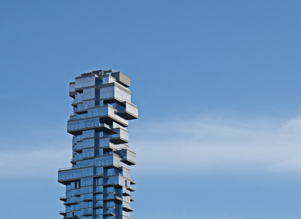 a tall building with a blue sky