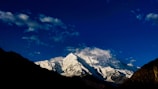a mountain range with clouds