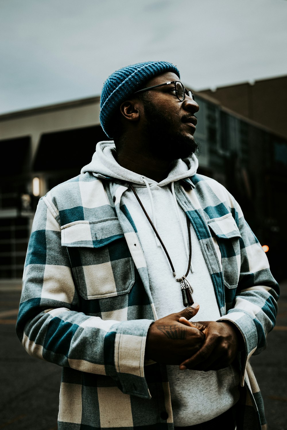 a man wearing a hat and glasses