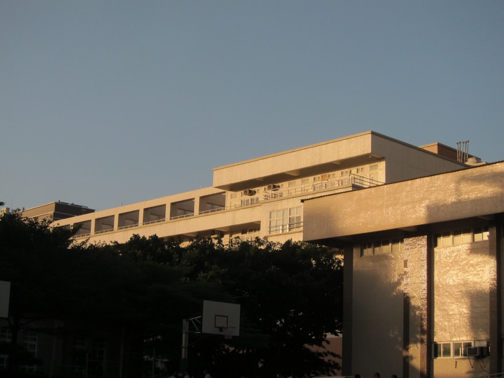 a building with trees in the front