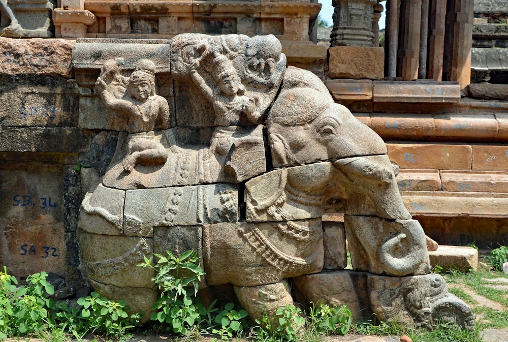 a stone sculpture of a lion