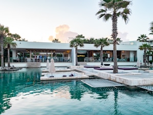 a pool with a building in the background