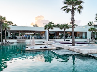 a pool with a building in the background