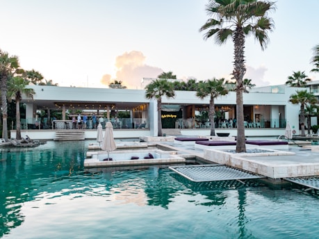 a pool with a building in the background