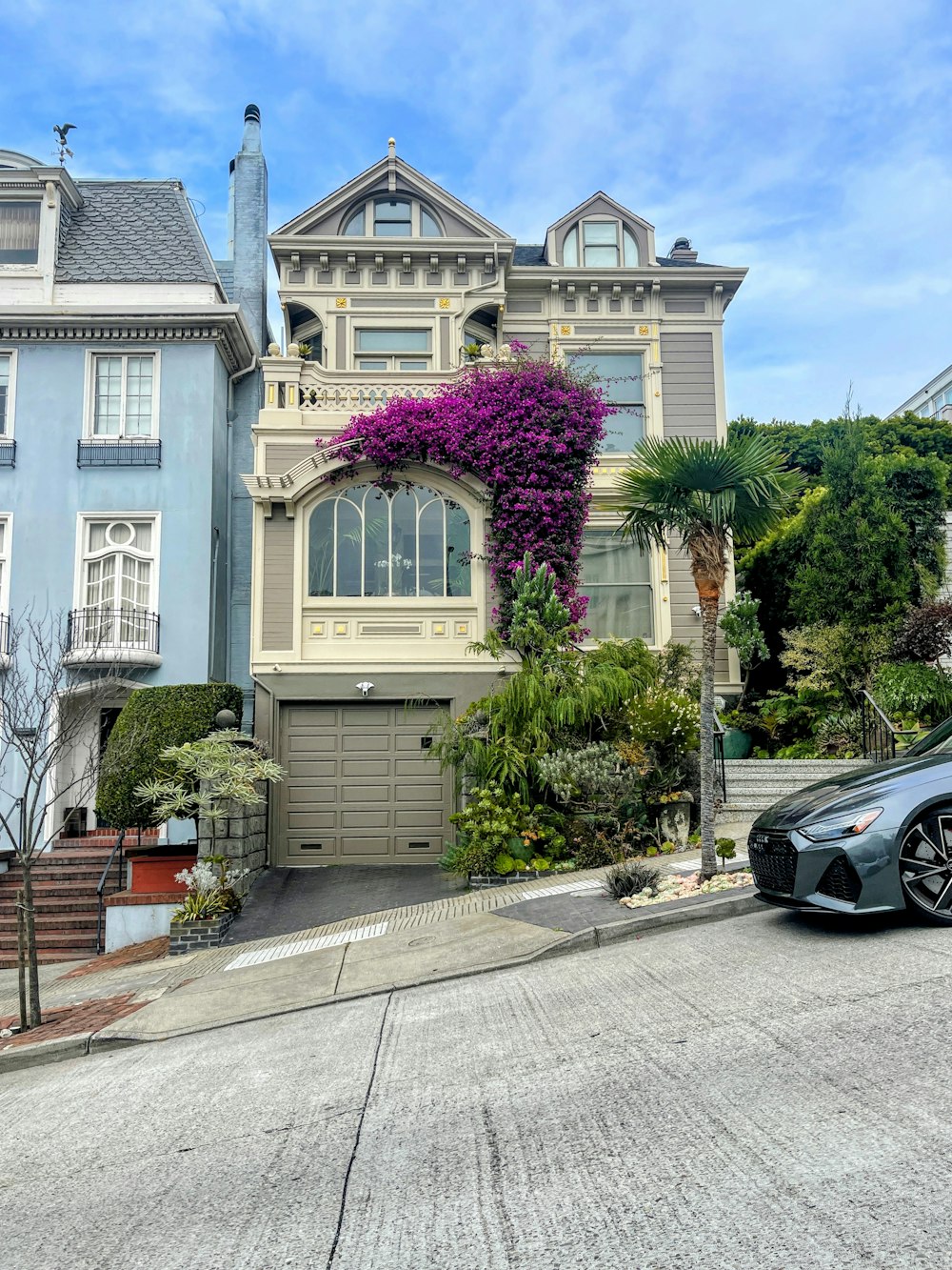 a house with a garage and trees