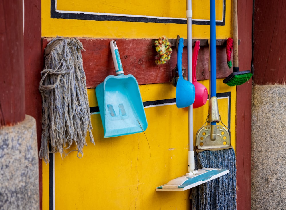 a yellow wall with a blue and white towel from it