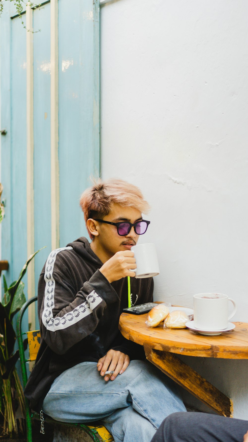 a woman sitting at a table eating food