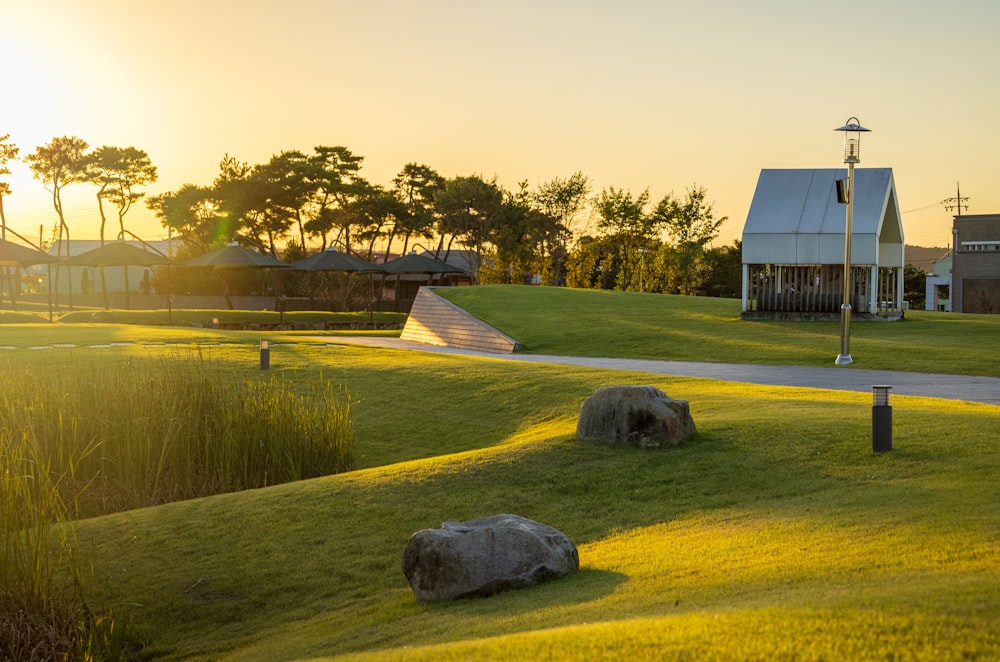 a golf course with a few buildings