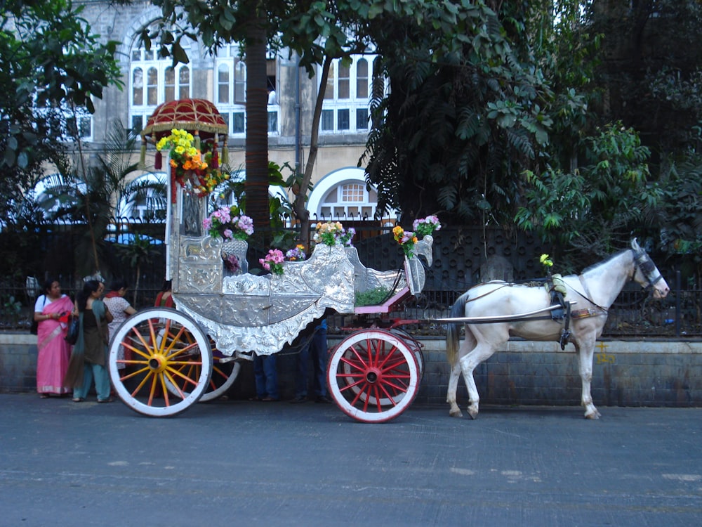 a horse carriage with flowers