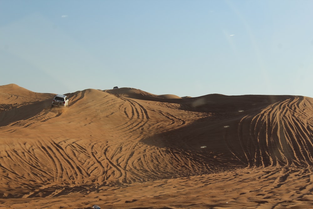 a car driving through a desert