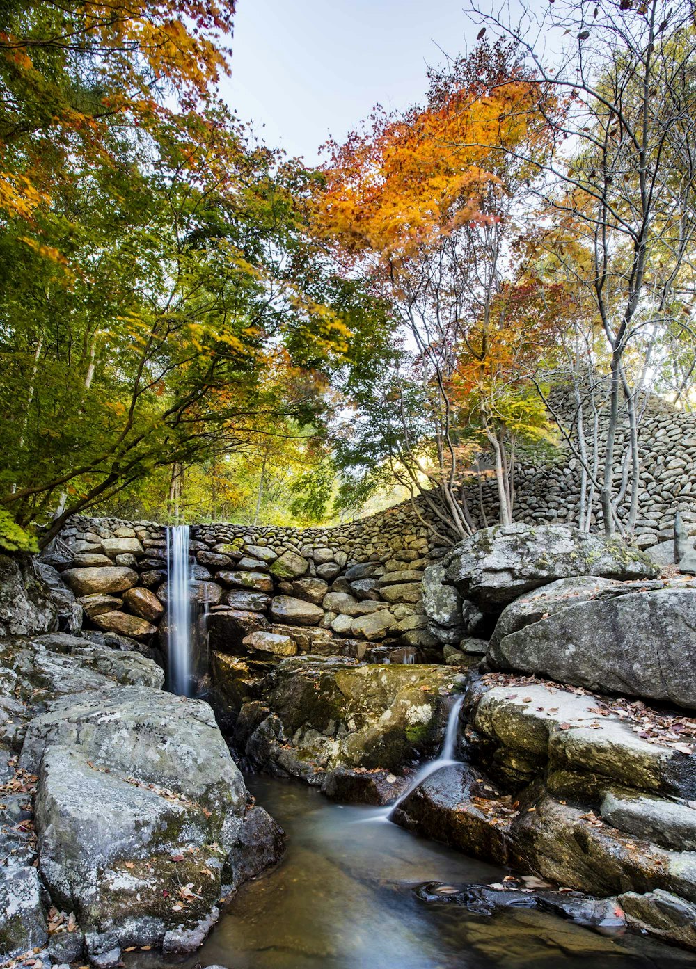 a small waterfall in a rocky area