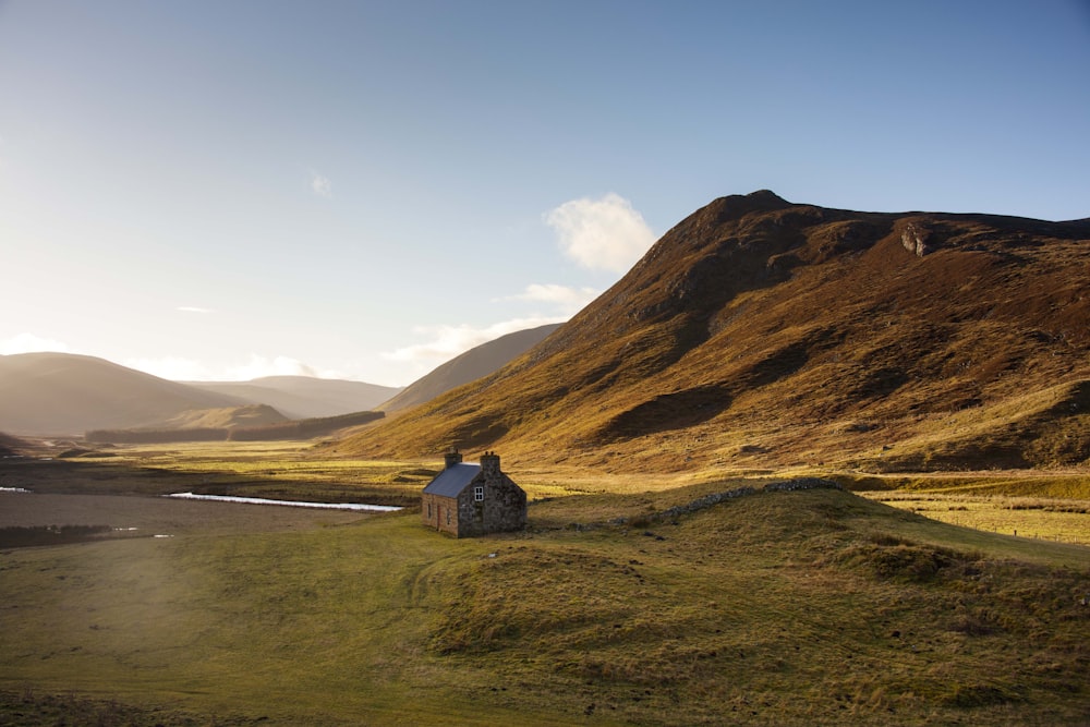 a small building on a hill