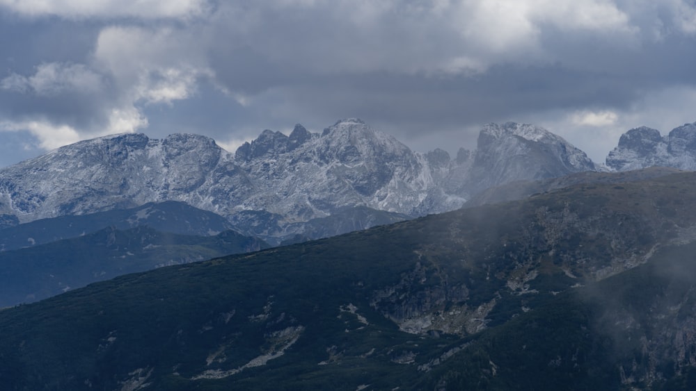 a mountain range with clouds