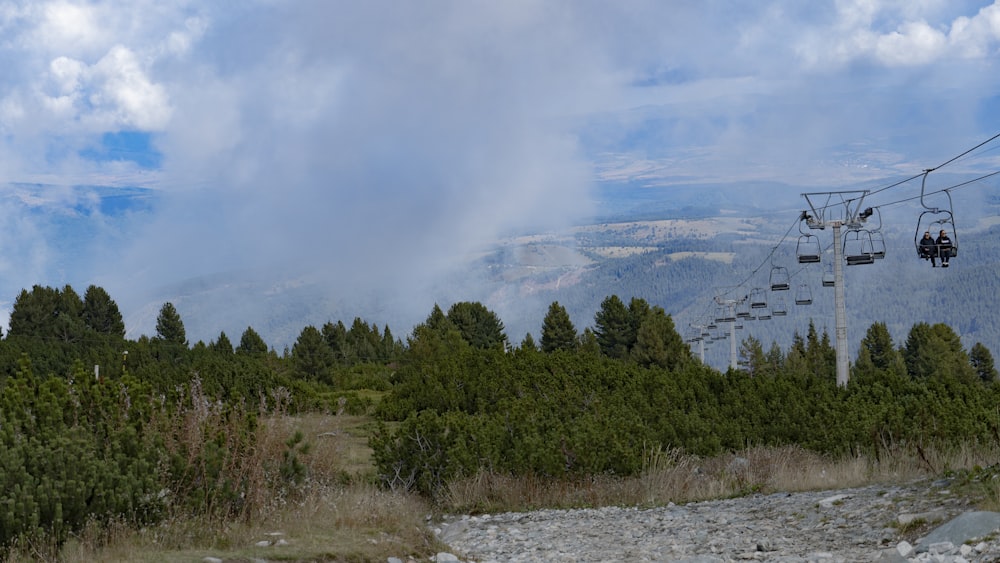 a ski lift going up a hill