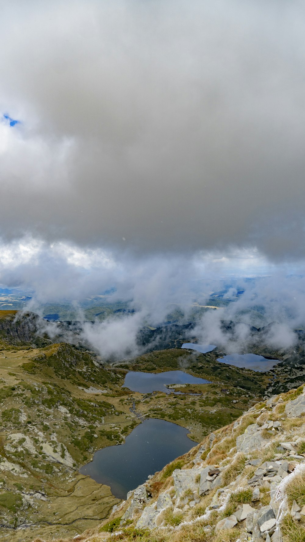 a body of water surrounded by mountains