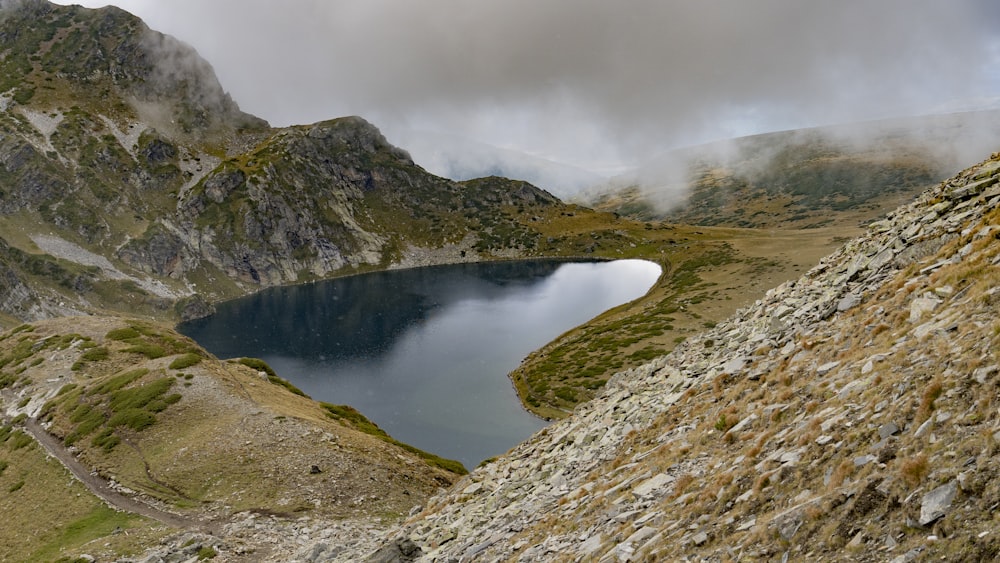 a small lake in a rocky area