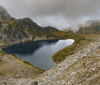 a small lake in a rocky area