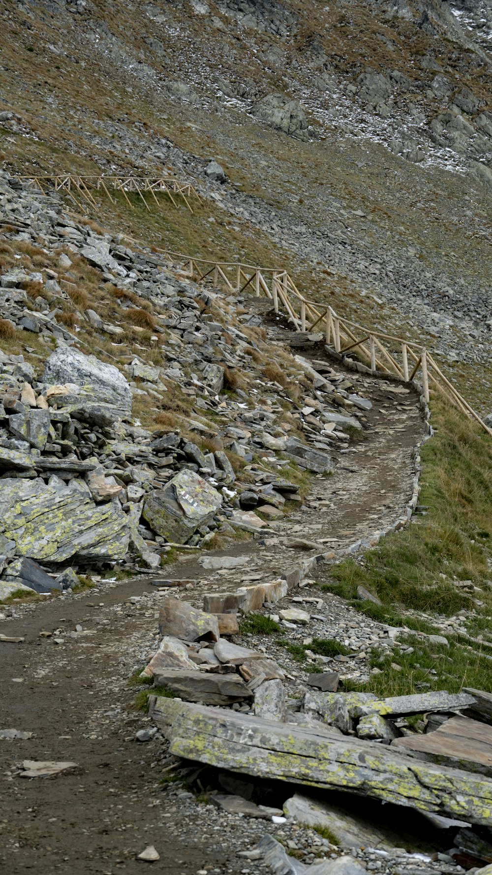 a rocky area with a wooden bridge