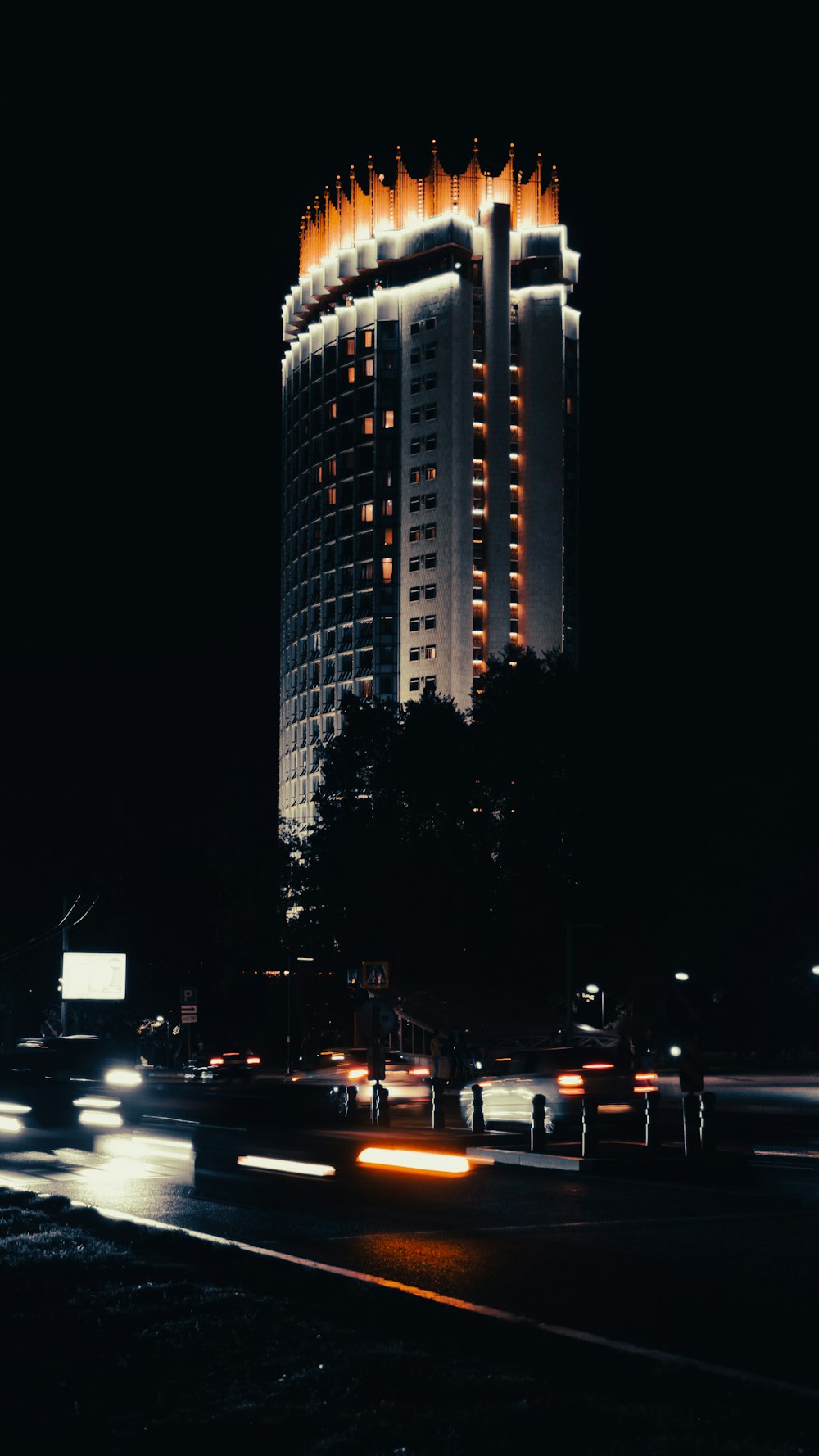 a tall building with lights at night
