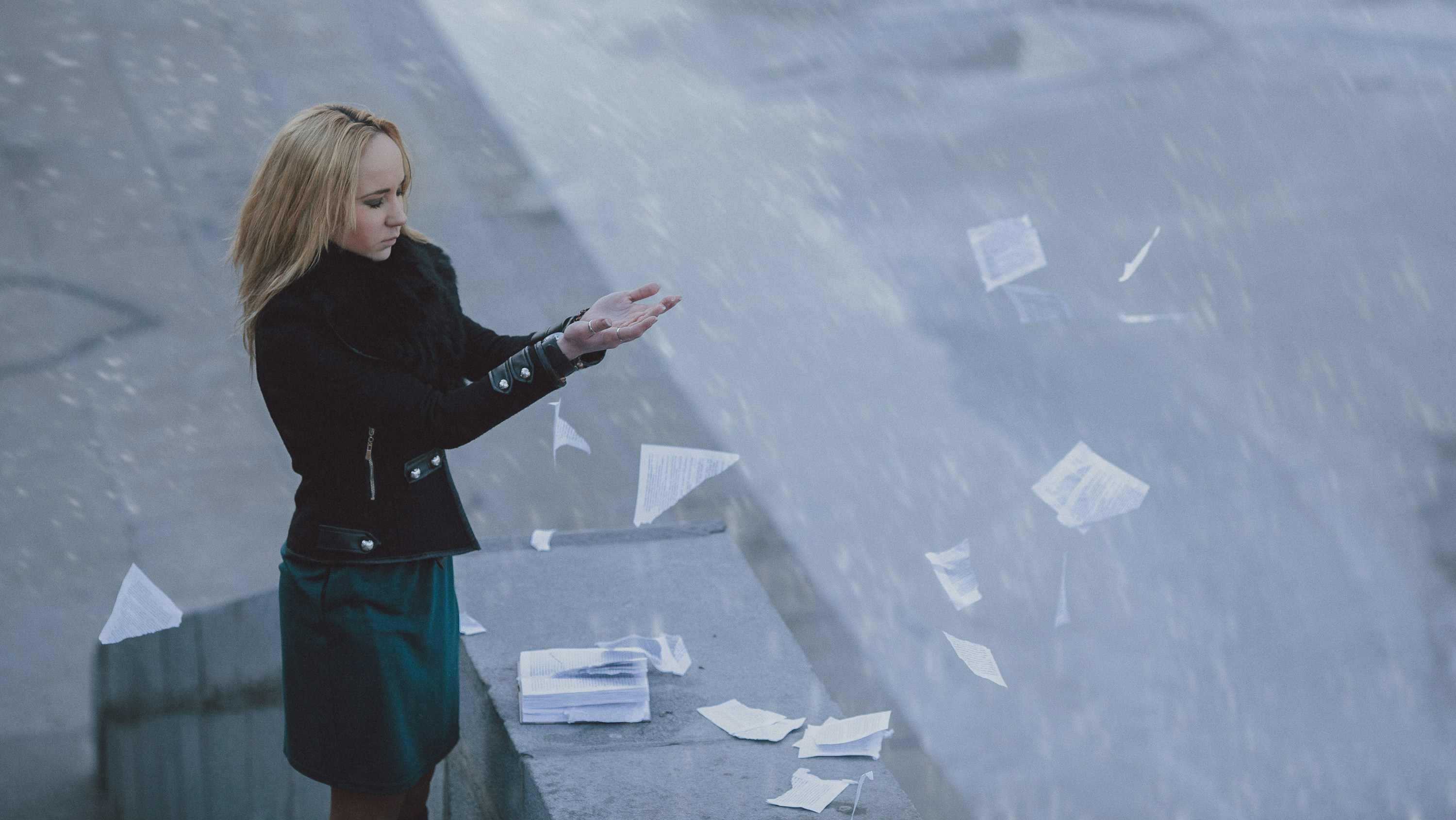 Business professional reviewing documents — illustrating How to Dissolve an LLC or Corporation in Virginia.