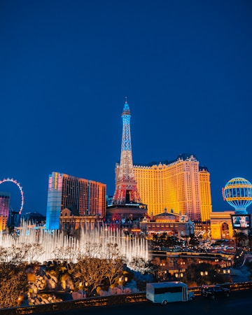Tall lit buildings in the Las Vegas urban core viewed from street level at dusk