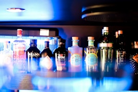a row of bottles on a bar