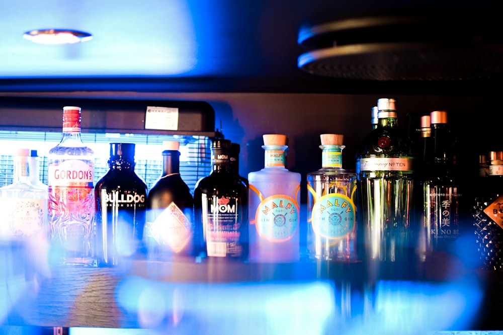 a row of bottles on a bar