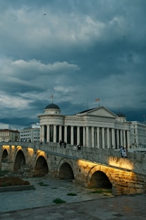 a bridge with a building in the background