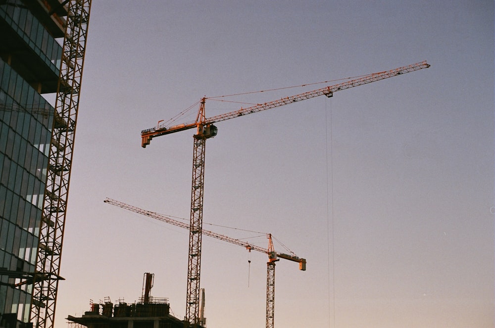 a crane next to a building