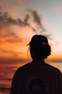 a person looking at the sunset