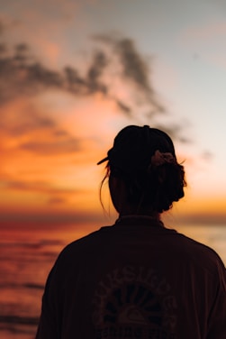 a person looking at the sunset