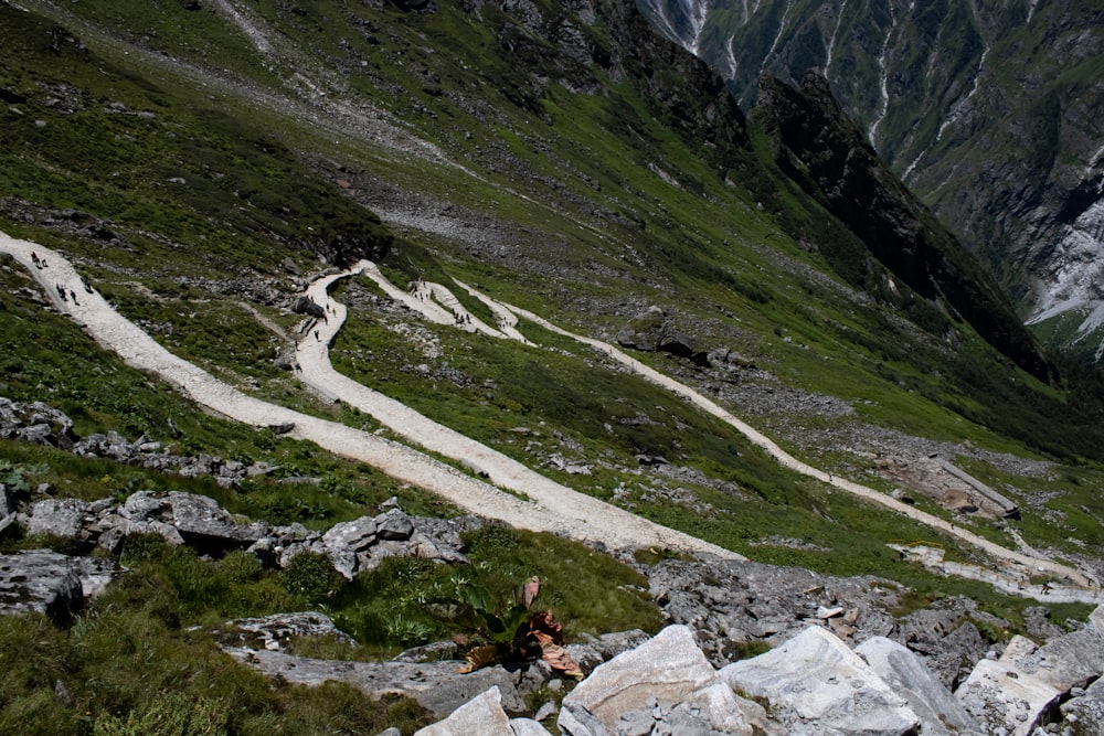 a person sitting on a rocky hillside