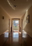 a hallway with a glass door